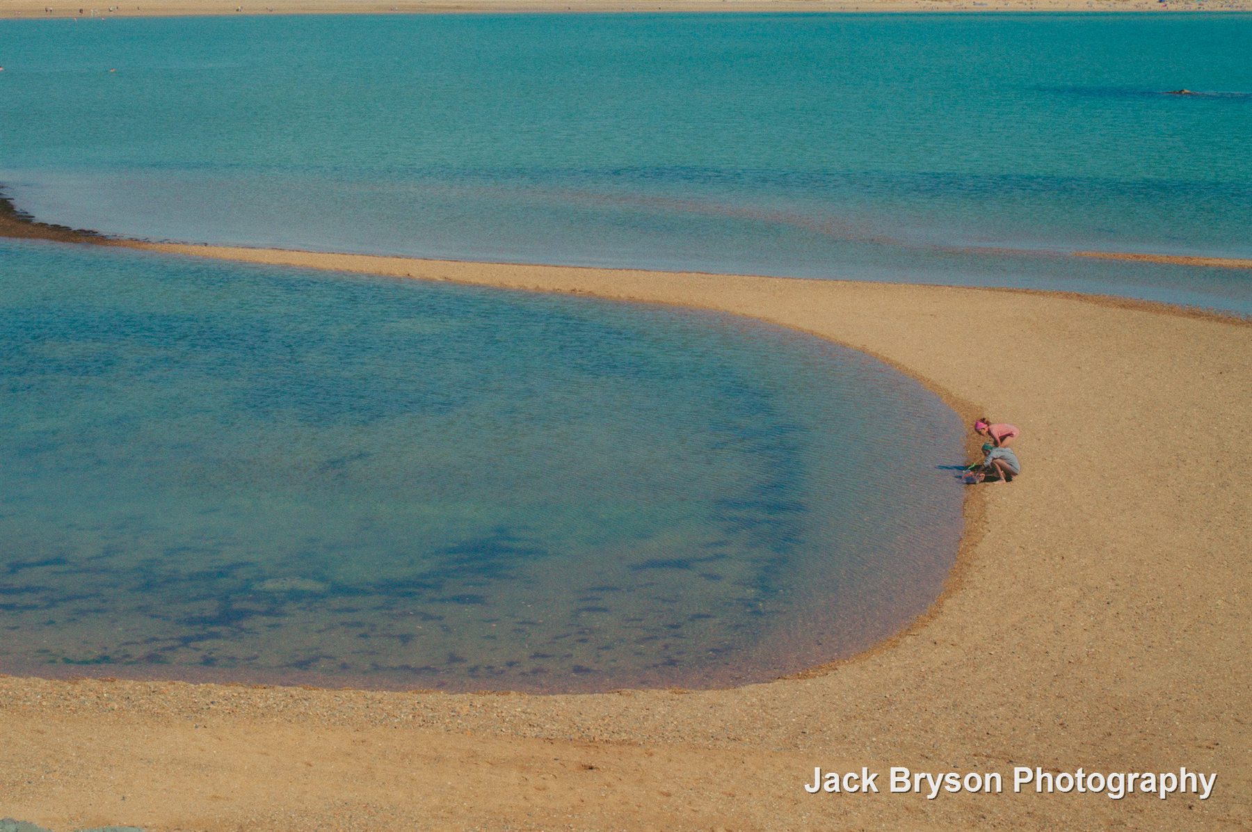 Colour beach photograph with turquoise water and sand